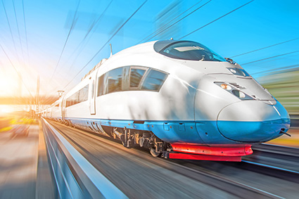 High speed train rides at high speed at the railway station in the city