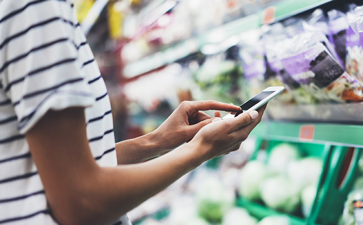Woman,Shopping,Healthy,Food,In,Supermarket,Background.,Close,Up,View