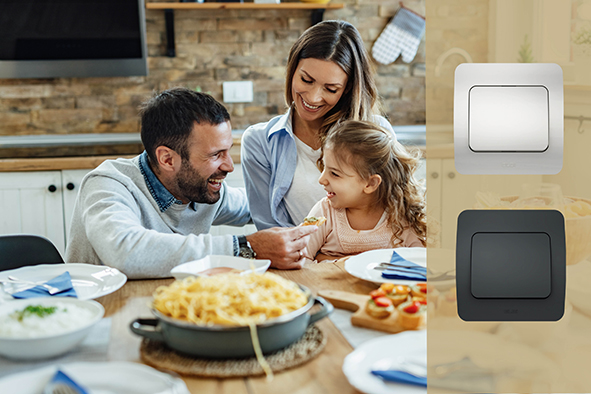 Young happy family having fun during lunch time at dining table.